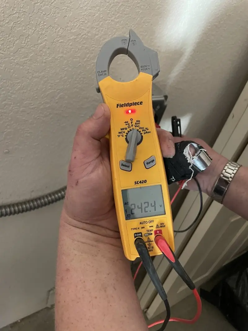 Voltage testing with clamp meter during Circuit Breaker Repair in Purcellville